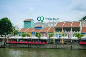 Singapore 16 may 2022. Scenic cityscape of Clarke Quay with Bumboats docked along Singapore River. photo