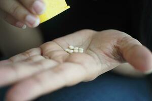 artificial sweetener on hand closeup photo