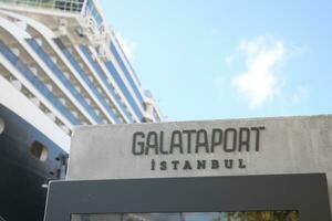 Turkey istanbul 19 june 2023. Galataport text and huge cruise ship photo