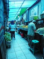 22 November 2023. Bandung City, West Java, Indonesia. Morning atmosphere at the entrance to the Cihapit Traditional Market. Traders and Buyers with their respective activities. photo