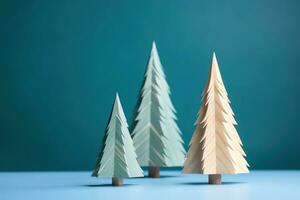 AI generated three paper christmas trees on a blue background photo