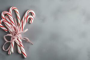 AI generated candy canes on a gray background photo