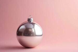 AI generated a shiny silver christmas ball on a pink background photo
