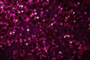 AI generated pink glitter stars on a black background photo