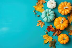 ai generado vistoso calabazas y hojas en un azul antecedentes foto