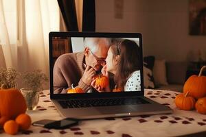 AI generated pumpkin carving on laptop photo
