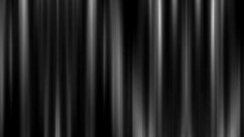 Abstract black background of a curtain in a theater or on stage illuminated by spotlight lamps made of iridescent stripes and lines video