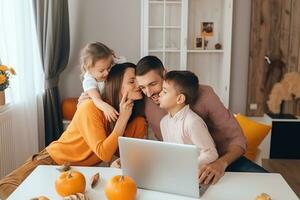 AI generated a family sitting at a table with a laptop and pumpkins photo