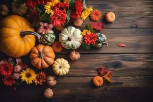 pumpkins and flowers on a wooden table photo
