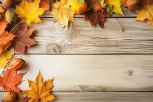autumn leaves and pumpkins on a wooden table photo