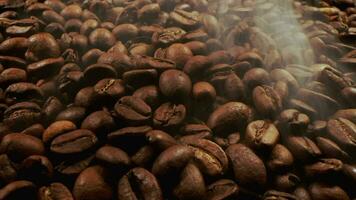 Close up of seeds of coffee. Fragrant coffee beans are roasted smoke comes from coffee beans. Preparation fresh aroma caffeine on manufacturing warehouse. video