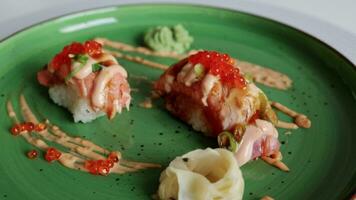 An enticing sushi roll with shrimp and unagi sauce, delicately placed on a plate. Perfect for an Asian menu video