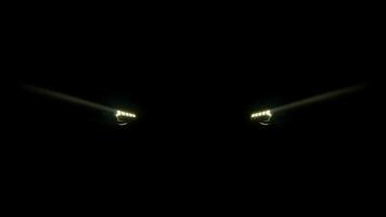 Car headlight blinking in Dark. Sports car Headlight. Switching of car LED headlights in night video