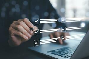 checklist and clipboard task documentation management, business people working laptop checklist questionnaire assessment form, online survey online exam Choosing the right answer in the exam photo