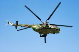 Military helicopter at air base. Air force flight operation. Aviation and aircraft. Air defense. Military industry. Fly and flying. photo