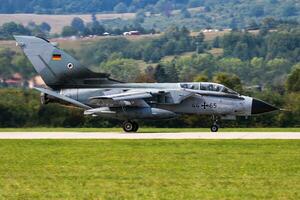 Military fighter jet plane at air base. Air force flight operation. Aviation and aircraft. Air defense. Military industry. Fly and flying. photo