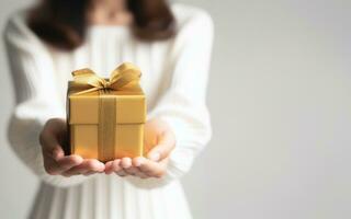 AI generated A woman holds a gift box forward Illustration of joyful events during the festival white background photo