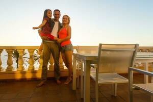 Tenderness in the family, window and sunset sun photo