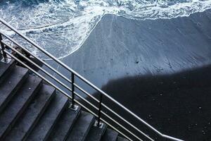 Staircase and view of the Ocean at sunset photo