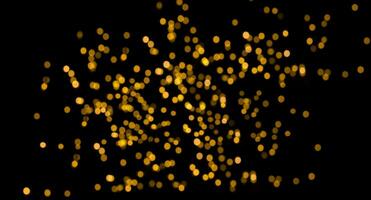 Abstract gold glitter, defocused image highlighted on a black background for overlay design. Golden blurred bokeh light. Photo. photo