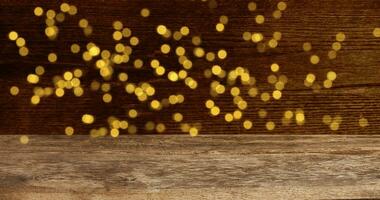 Empty Wooden table in front of abstract blurred festive light background. Defocus Christmas background with golden lights. Photo. Christmas background. photo