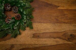 Wooden textured background with Christmas wreath. View from above. photo. Empty background. photo