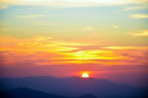 sunset on top of the mountain photo