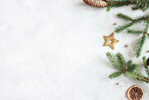 Christmas composition. Fir tree branches, red decorations on gray background, Flowers composition. White and purple flowers on marble background, Eucalyptus leaves, winter, top view. Christmas gift. photo