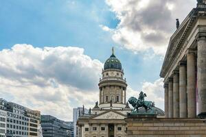 Berlin, Germany-august 9, 2022-view of one of the two churches in Gendarmenmarkt square during a cloudy day photo