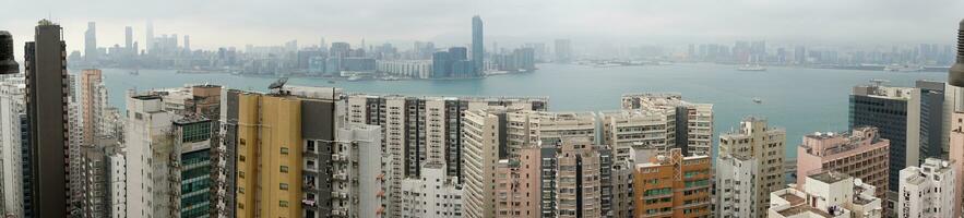 Hong Kong,March 26,2019-Panorama of skyscrapers of hong kong bay during a hazy day photo