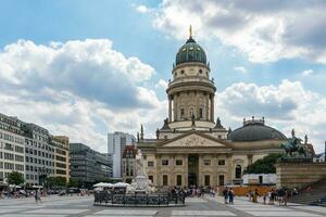 Berlin, Germany-august 9, 2022-view of one of the two churches in Gendarmenmarkt square during a cloudy day photo