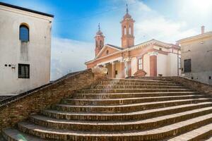 Comacchio ,Italy-June 2, 2023-View of one of the bridges in Comacchio during a sunny day photo