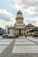 Berlin, Germany-august 9, 2022-view of one of the two churches in Gendarmenmarkt square during a cloudy day photo