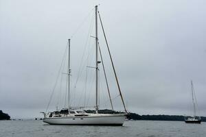 Scenic View of a Luxury Sailboat Moored in a Harbor photo