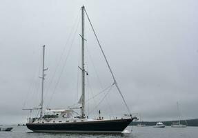 Large Moored Sailboat Anchored in the Harbor photo