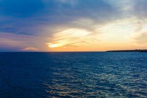 Sun Setting on the Atlantic Ocean in Tenerife Canary Island Spain photo