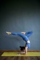 woman doing advance yoga pose photo