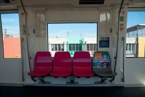 Bangkok, Thailand-November 2, 2023- Seats inside sky train of metropolitan rapid transit pink line photo