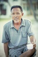 face of asian man relaxing emotion looking with eyes contact to camera photo