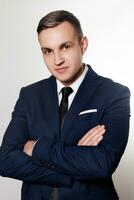 Portrait of handsome man in black blue suit photo