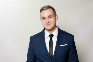 Portrait of handsome man in black blue suit photo