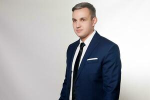 Portrait of handsome man in black blue suit photo