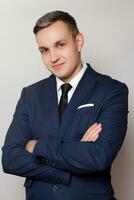 Portrait of handsome man in black blue suit photo