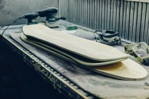 A carpenter cuts a board with an electric jigsaw. photo