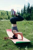 Healthy young independent female yoga practitioner photo