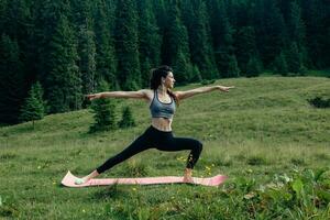 Healthy young independent female yoga practitioner photo