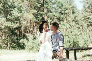 Wedding walk in the pine forest. Sunny day. photo