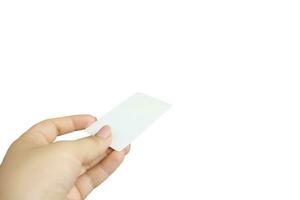 Female hand holding business card isolated on white background photo
