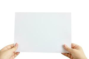 Empty space for text. A female hands holding card isolated on a white background. photo