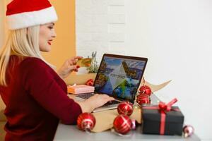 booking christmas vacation on laptop photo